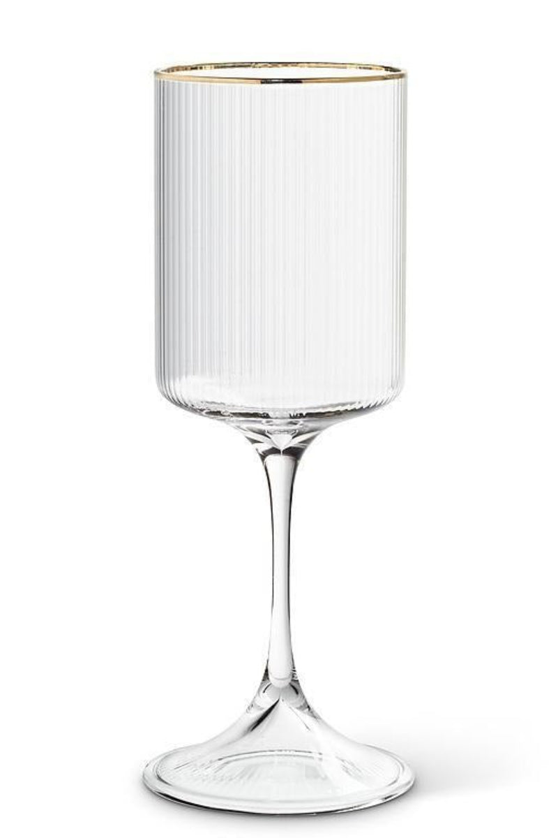 Clear ribbed glass wine glass with gold rim on a white background