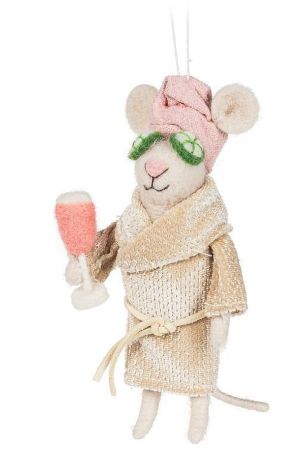 White felted mouse in a pink robe and towel wrapped around her head.  She is  holding a glass of rosé with cucumber slices on her eyes.  The image has a white background