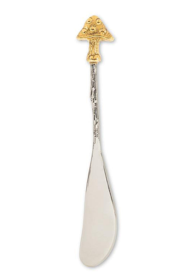 Decorative pate spreader with gold top on a white background