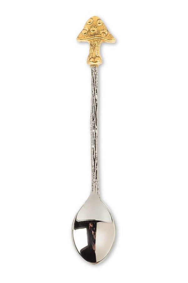 Decorative spoon with gold top on a white background