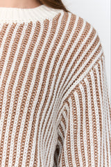 Close-up of a brown and white striped sweater