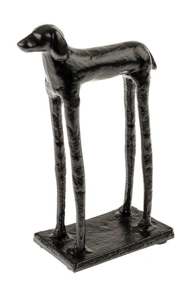 Black dog sculpture on a white background
