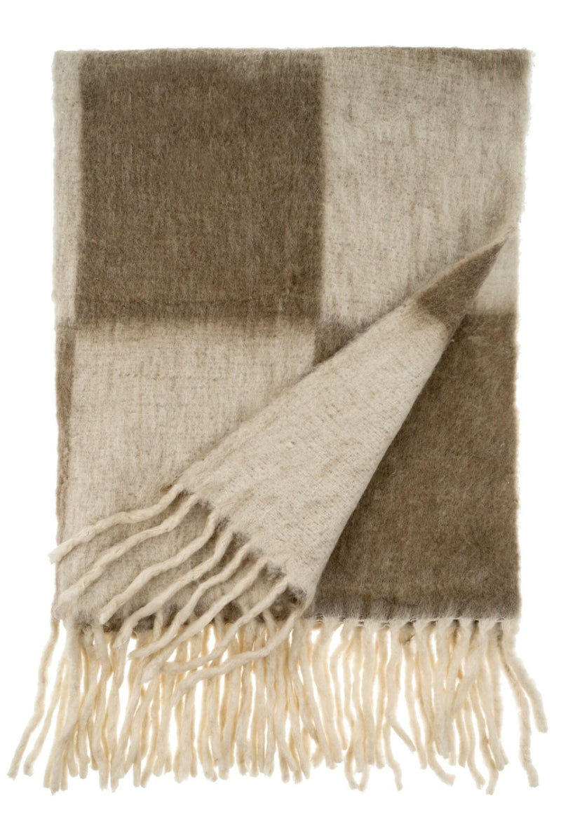 Plaid blanket with fringes on a white background