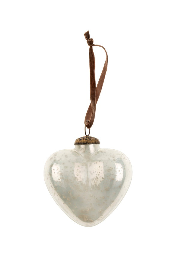 Heart-shaped glass ornament with a brown string on a white background