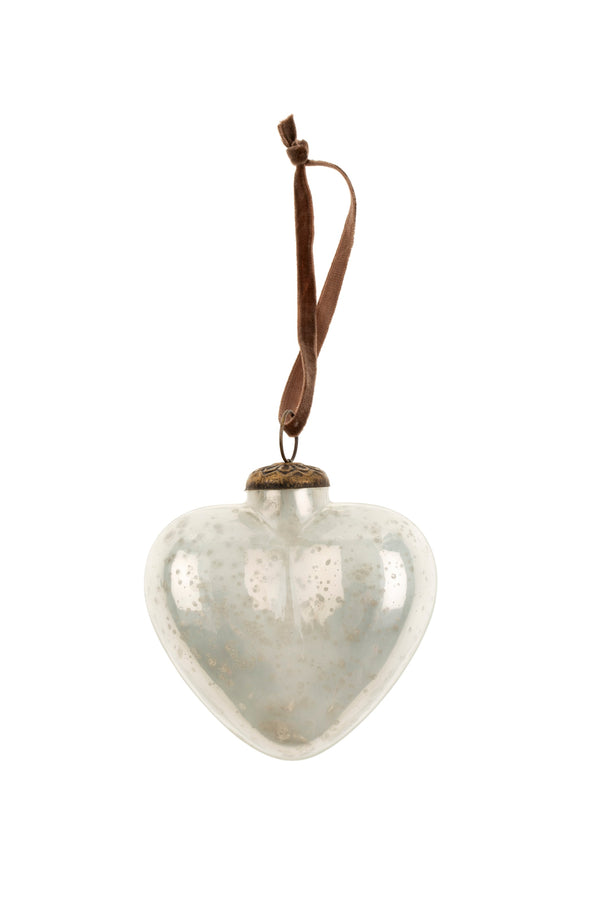 Heart-shaped glass ornament with a brown string on a white background