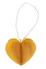 Brass heart-shaped hanging ornament on a white background