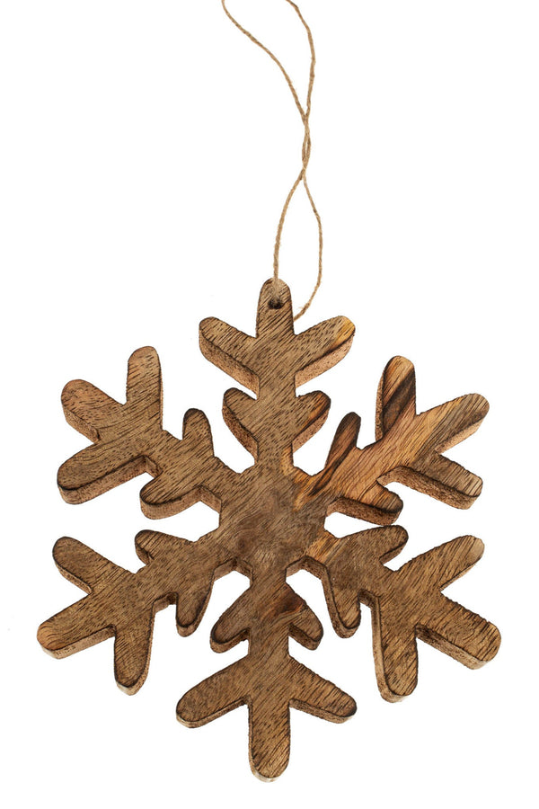 Wooden snowflake ornament on a white background