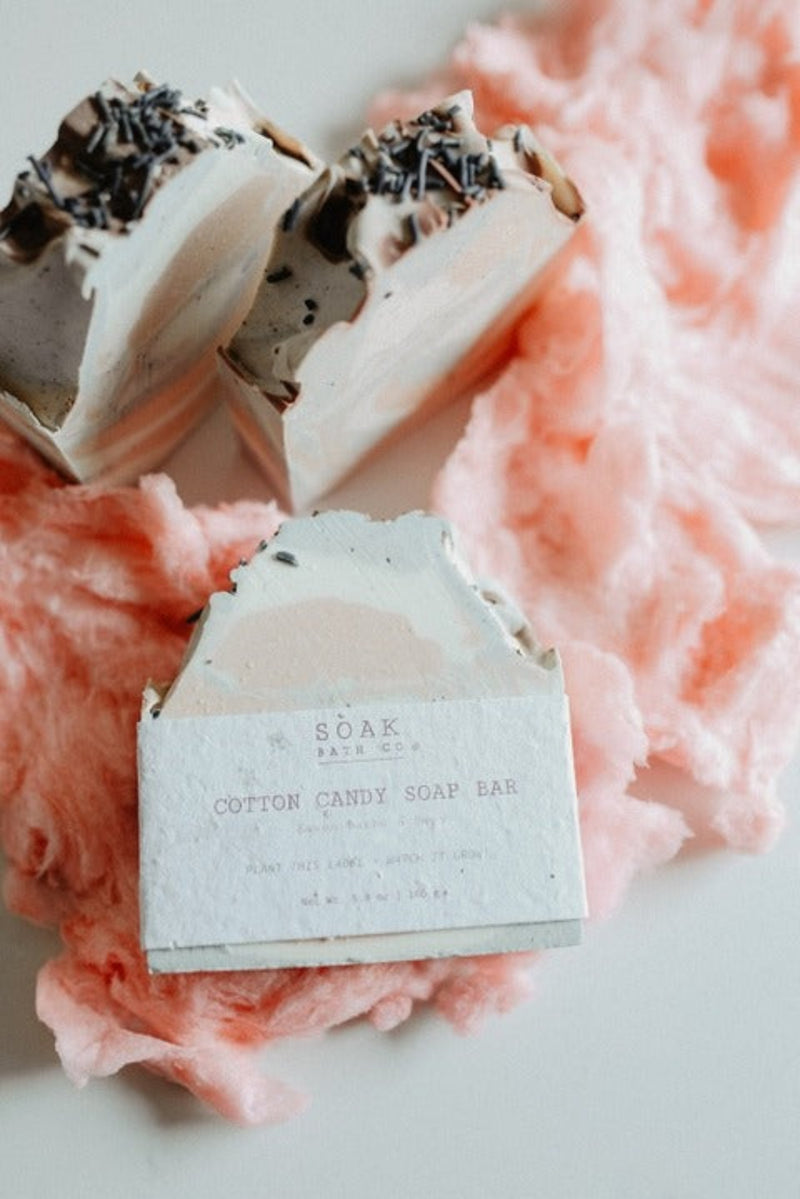 Cotton candy soap bar with a label on a pink fluffy background