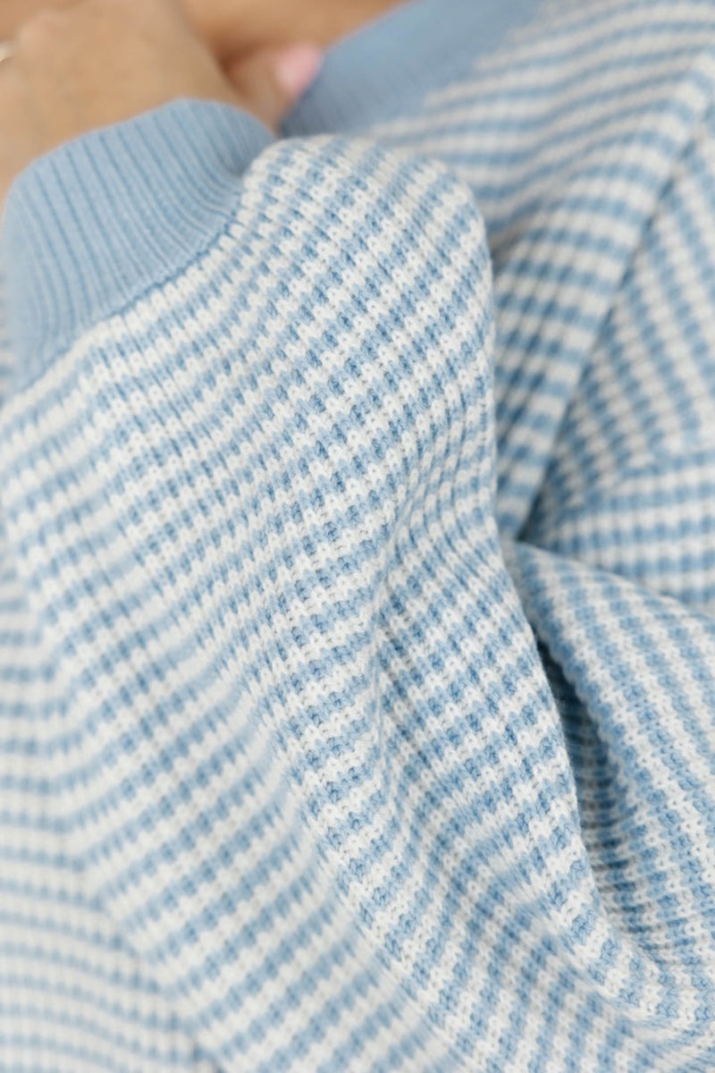 Close-up of a blue and white striped fabric texture
