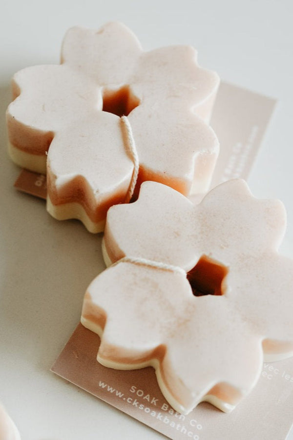 Flower-shaped soap bars on a white background