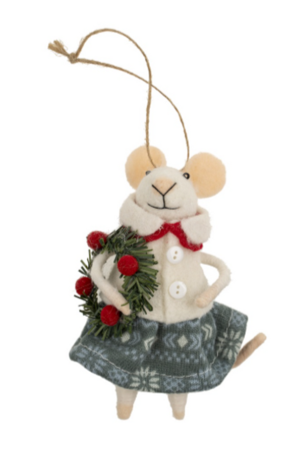 Felt mouse ornament hanging from a string wearing a white shirt and blue skirt holding a wreath on a white background