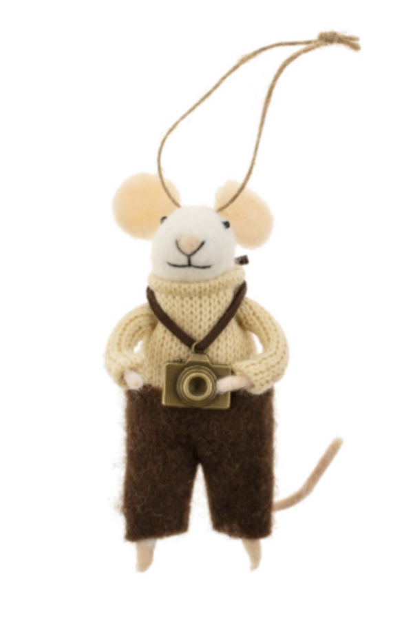 Felted white mouse figurine on a string wearing a cream turtleneck sweater and brown felted pants, carrying a camera on a white background