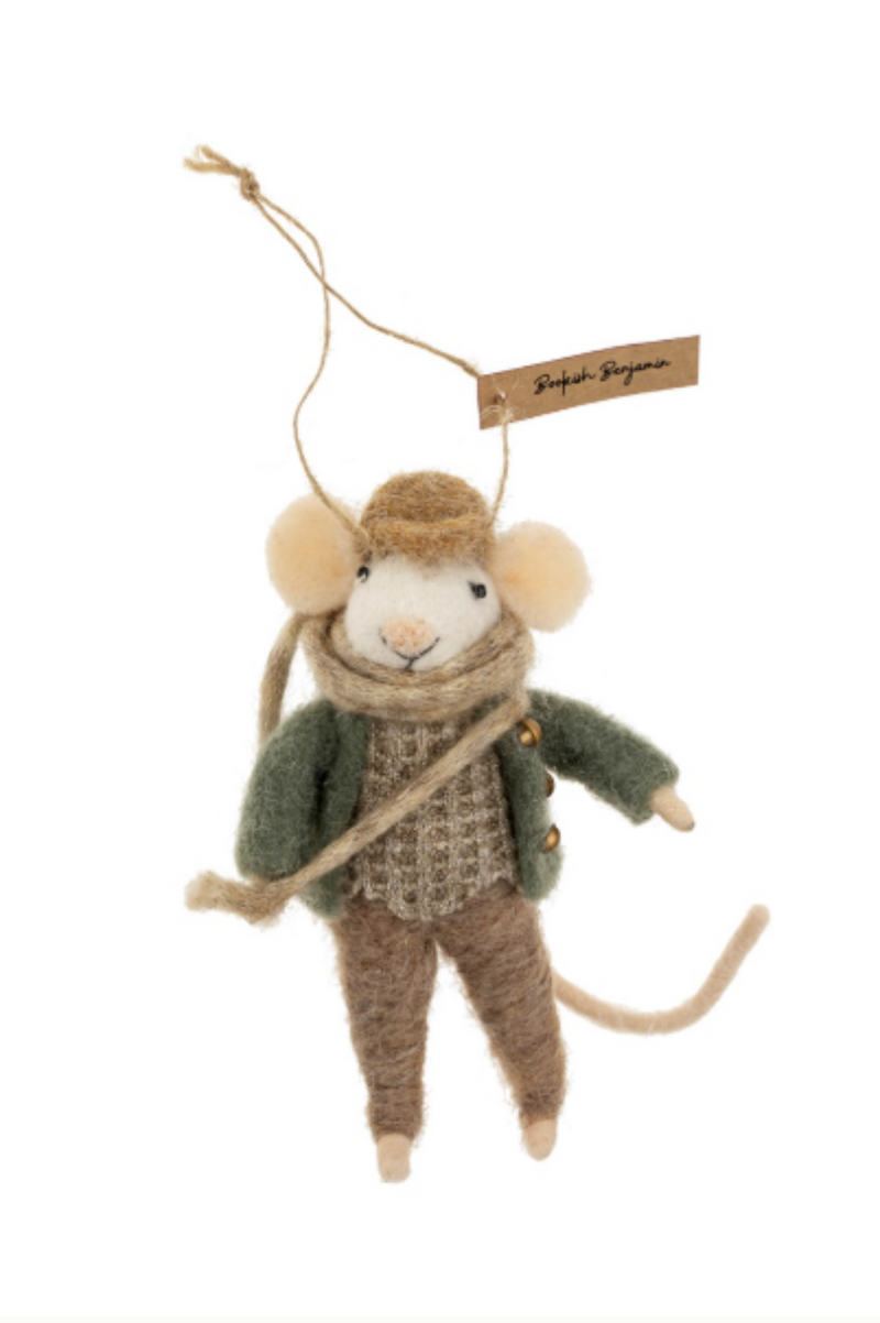 Felted white mouse figurine on a string wearing a green felt coat, brown felt pants and a light brown waffle knit shirt and brown hat on a white background