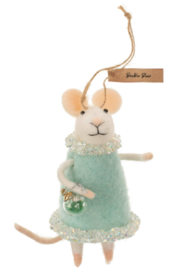 Felted white mouse figurine on a string wearing an aqua dress trimmed with white beads, carrying a green ball ornament on a white background