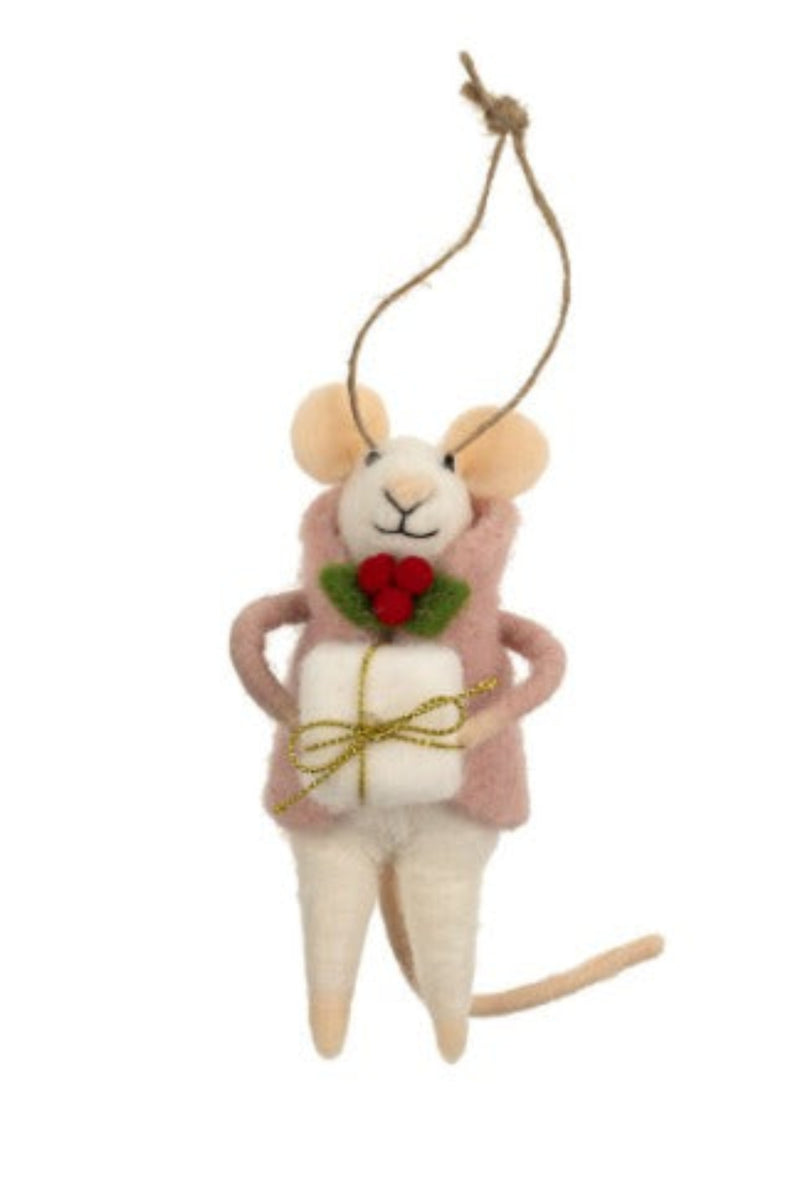 Felt mouse ornament hanging from a string wearing a pink jacket, carrying a white gift box against a white background