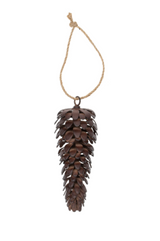 Pine cone ornament hanging on a string against a white background