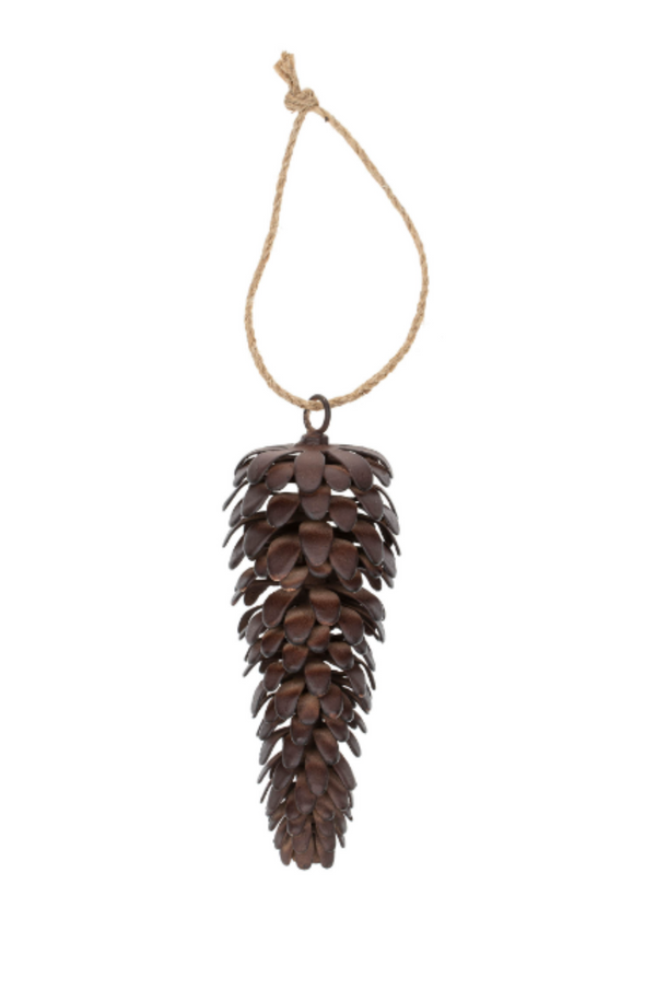Pine cone ornament hanging on a string against a white background
