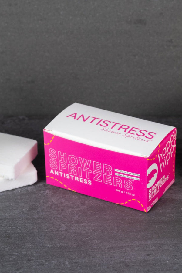 Box of Antistress Shower Spritzers on a dark surface.