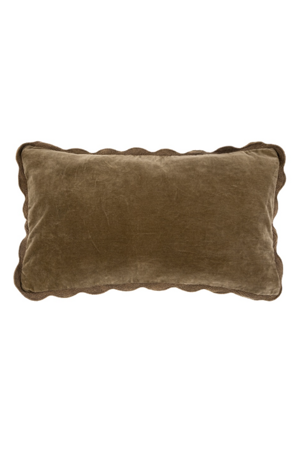 Brown pillow with scalloped edge on a white background
