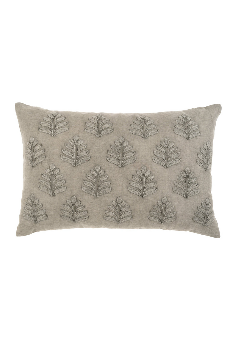 Gray pillow with leaf pattern on a white background