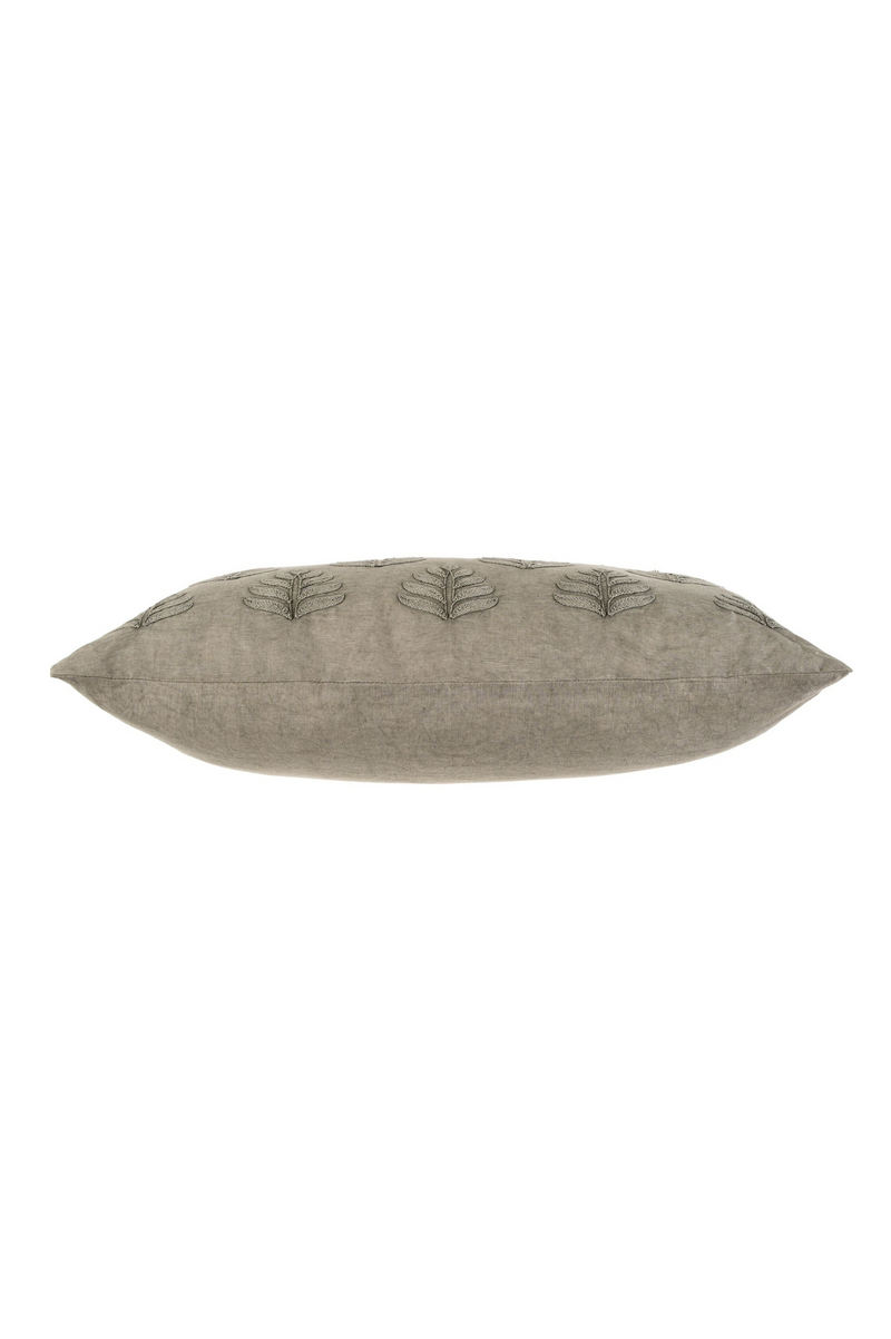 Textured rectangular pillow with leaf pattern on a white background