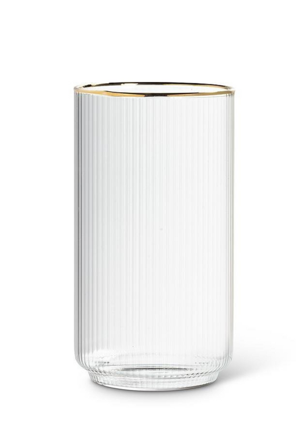 Clear ribbed glass tumbler with gold rim on a white background