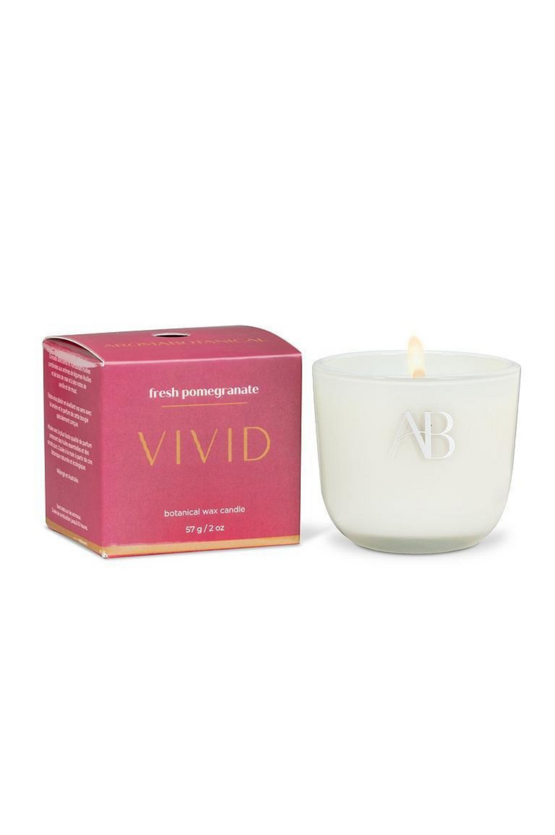 White candle with a pink box labeled 'Vivid' on a white background