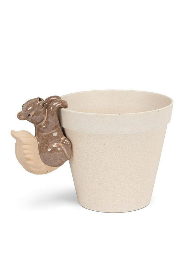 White planter with a squirrel hanger on a white background