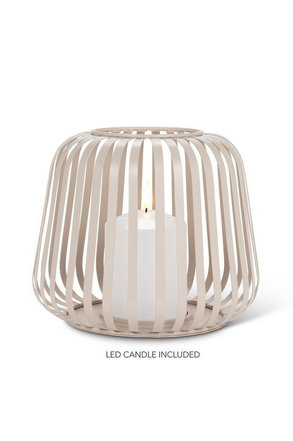 Decorative candle holder with a lit LED candle on a white background