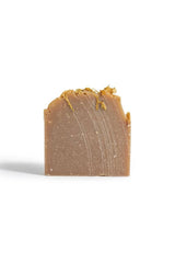 Bar of brown soap on a white background