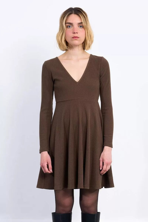 Woman wearing a brown dress on a white background