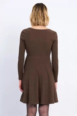 Brown dress worn by a person on a white background