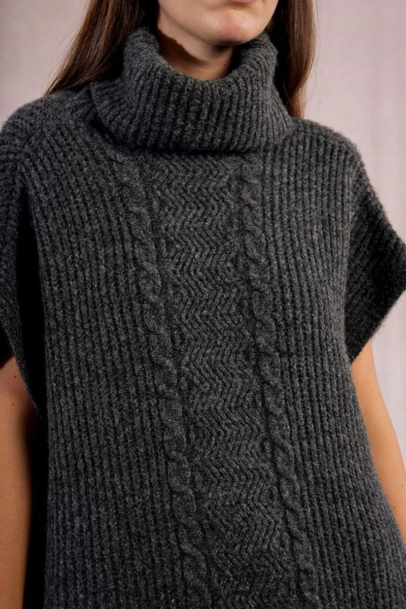 Dark gray knitted sweater with a pattern on a neutral background